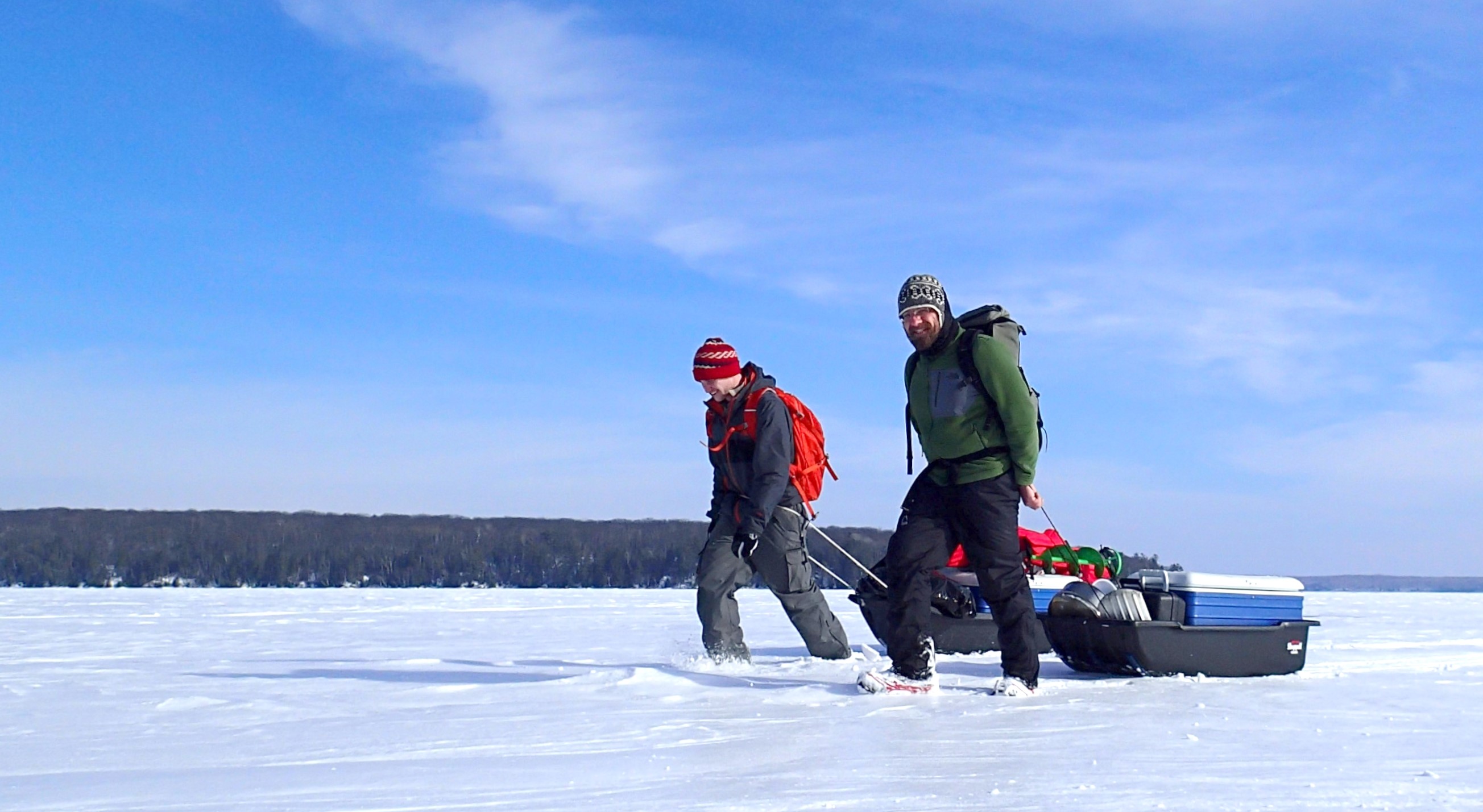 Ozersky and Kiril Shchapov pull a sled with research supplies on frozen lake