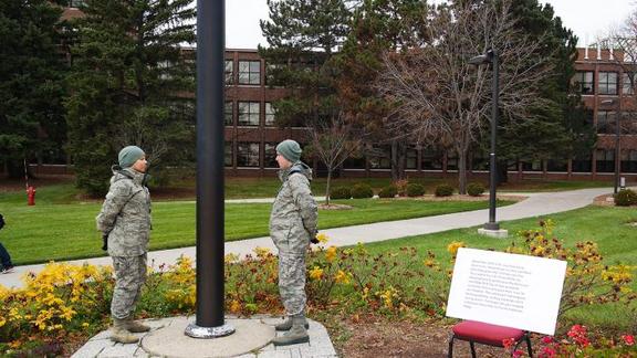 cadets stationed at flag pole