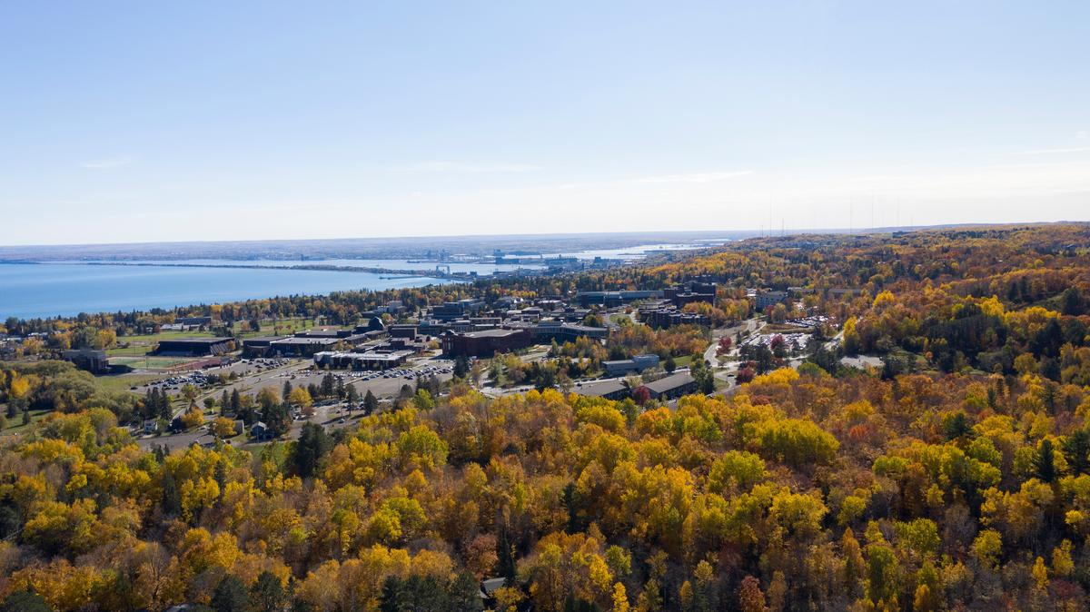 Campus from above with Lake Superior and fall colors