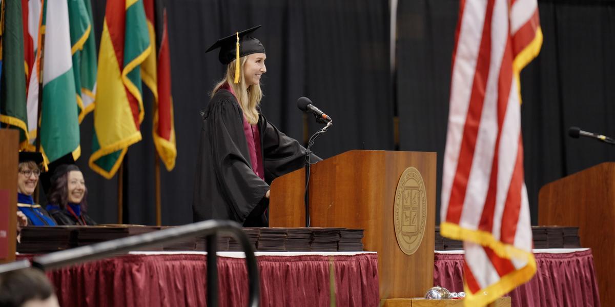 Amanda Fowler on the commencement stage giving her speech 