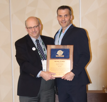 Dr. Plumier Accepting ATSM award