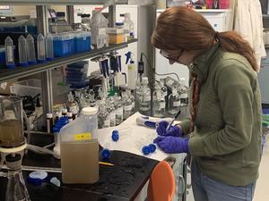 Katie Cassidy runs water quality testing in the NRRI lab.