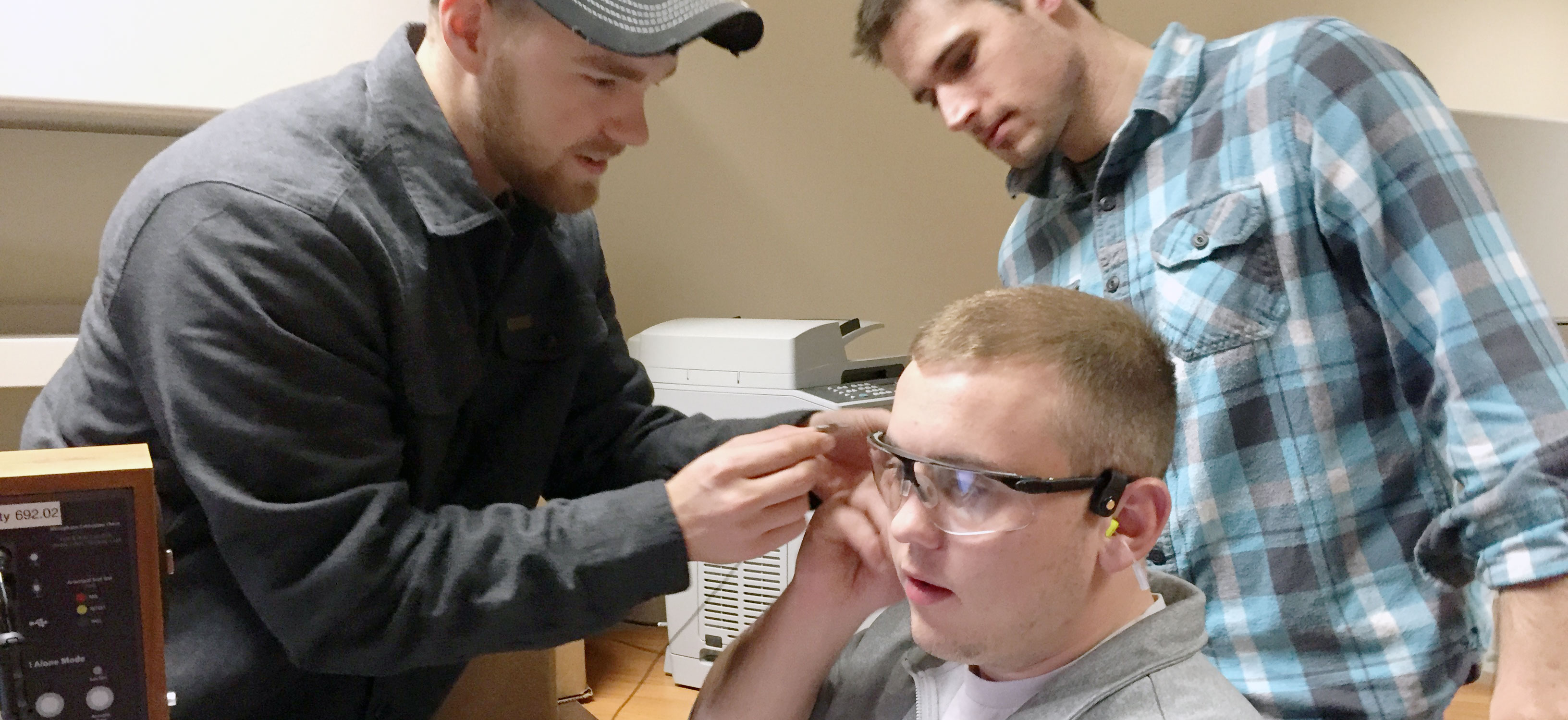 Students testing ear plugs